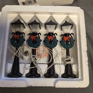 Department 56 Black Lamp Posts with Green Wreaths and Red Bows